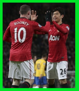 ルーニー香川コンビハイタッチ